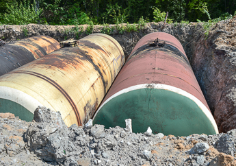 Three older underground storage tanks uncovered in a soil pit 