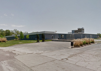 The front entrance and parking lot of the 221 Sunset Drive facility, formerly known as Modine Manufacturing Co., in Camdenton, Missouri.