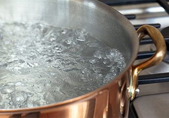 Boiling water in a stockpot on a stove
