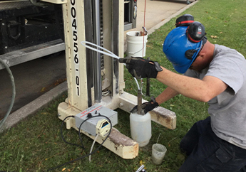 Environmental Services Program staff collecting soil gas samples as part of a Superfund investigation the Plaza Ford Ideal Cleaners site in Jackson County.