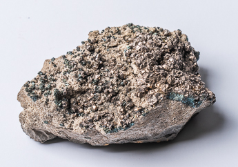 Silvery metallic crystals of siegenite, a cobalt-nickel-sulfide mineral, on dolomite