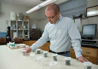 A person using scanning spectrofluorometers to detect tracer dye in water samples