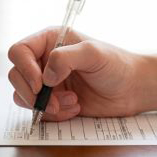 An individual filling out a department form