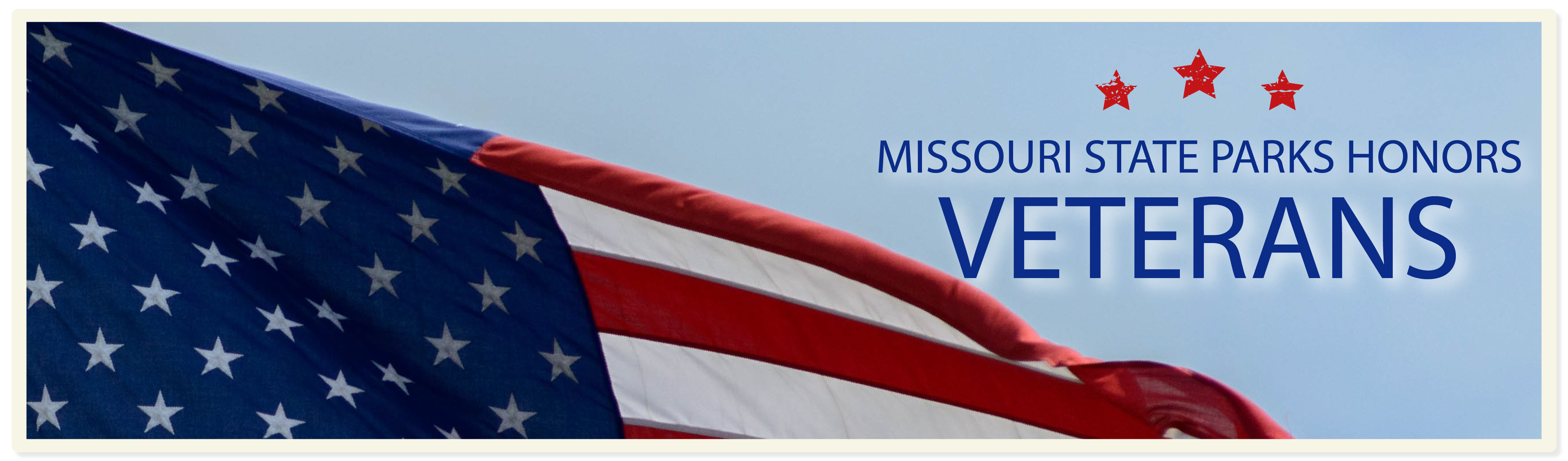 American flag flying in a clear blue sky with the words "Missouri State Parks Honors Veterens"