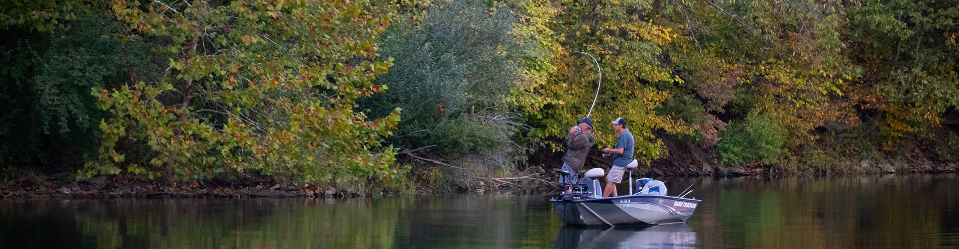 Two men fishing from a Bass Tracker boat