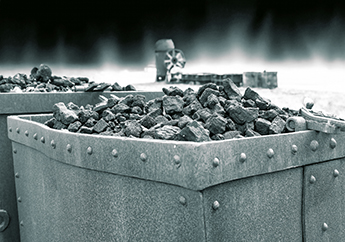 Old towing tender filled with coal