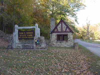 Sam A. Baker State Park cantilever sign in front of stone structure