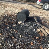 Environmental emergency response responds to a drum of used oil that was dumped on bank of Bourbeuse River near Union.