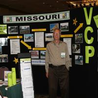 MoDNR employee Larry Baer in front of the BVCP exhibit at the 2015 Conference