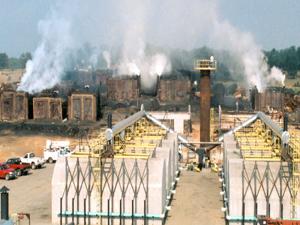 Photograph of charcoal kiln before air quality emissions where restricted. 