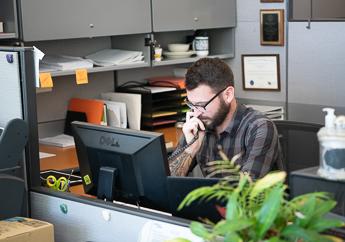 A department employee talking to an individual on the telephone