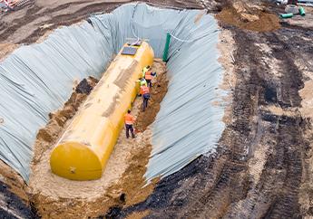 an underground storage tank installation in a lined pit