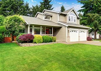 The front view of a home in a typical suburban neighborhood.