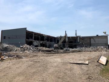 Backside of a building demolition during site cleanup and redevelopment.