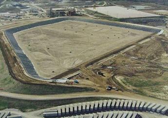 Ariel view of the Weldon Spring Site disposal cell under construction. The liner has been installed and engineered cap construction has begun.