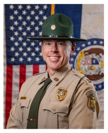 Captain Geoffrey Evans in uniform smiling.